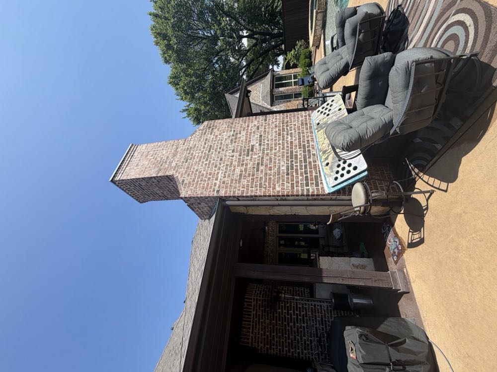 Tall luxury brick chimney in North Texas after breathable waterproofing treatment