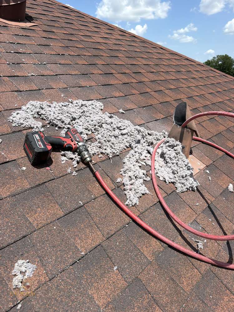 Pile of lint removed from a clogged dryer vent on a Dallas–Fort Worth roof