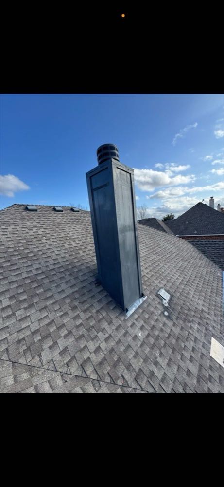 Weathered metal chimney cap repaired and refitted on a North Texas roof