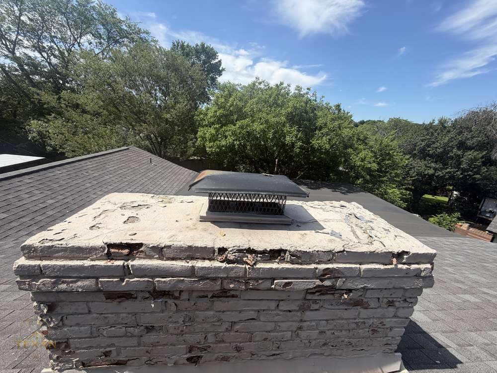 Spalling, flaking brick on a North Texas chimney before masonry restoration