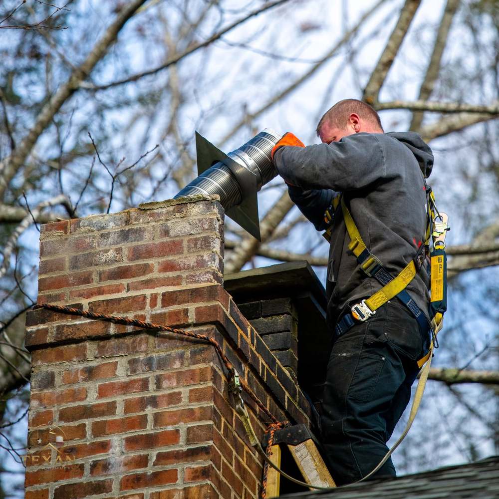 Stainless chimney liner connected at the flue top during relining in North Texas