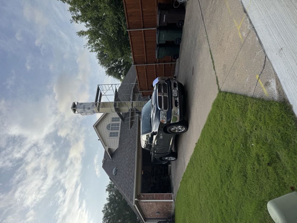 Texan Flue service truck arriving for a gas fireplace tune-up in Dallas–Fort Worth